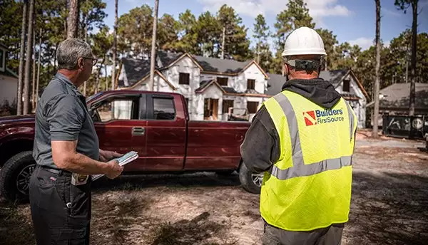 BFS Worker and Other Worker in Front of Jobsite