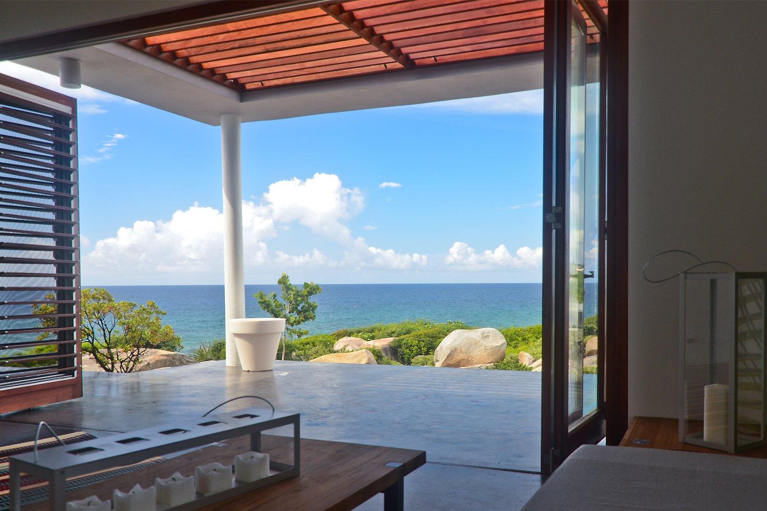Large, open patio doors overlooking the ocean
